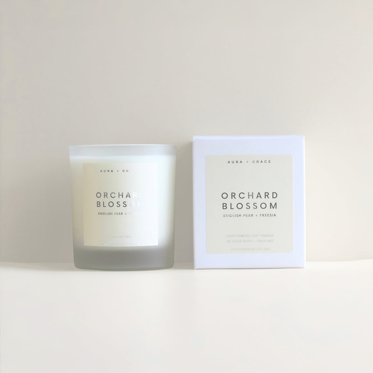 Orchard Blossom luxury soy wax candle in frosted glass vessel by Aura + Grace