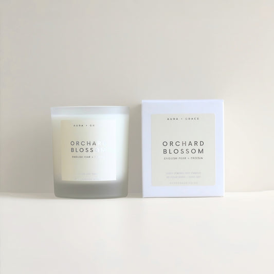 Orchard Blossom luxury soy wax candle in frosted glass vessel by Aura + Grace