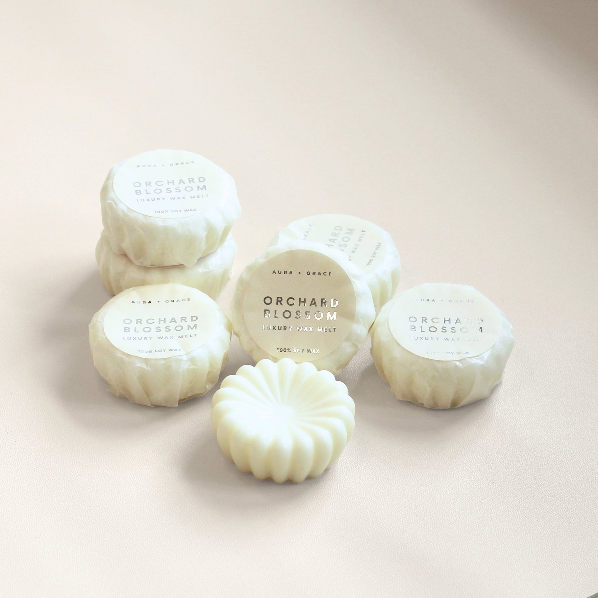 Hand-poured Orchard Blossom scented wax melts in luxury packaging