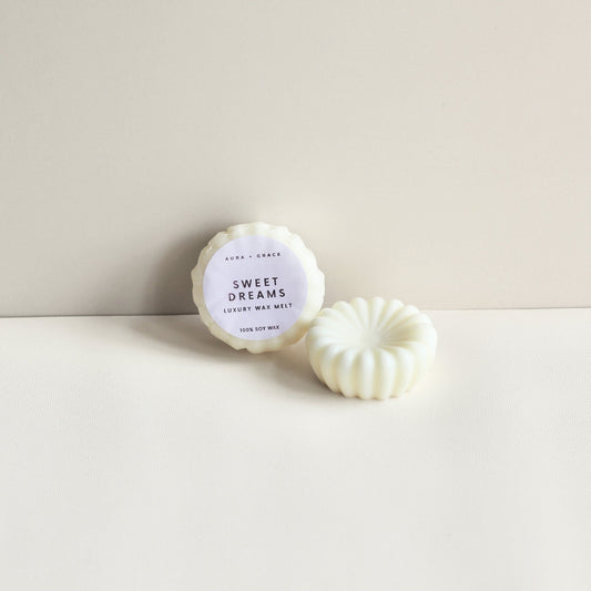 Sweet Dreams soy wax melts showing wrapped and unwrapped melt by Aura + Grace