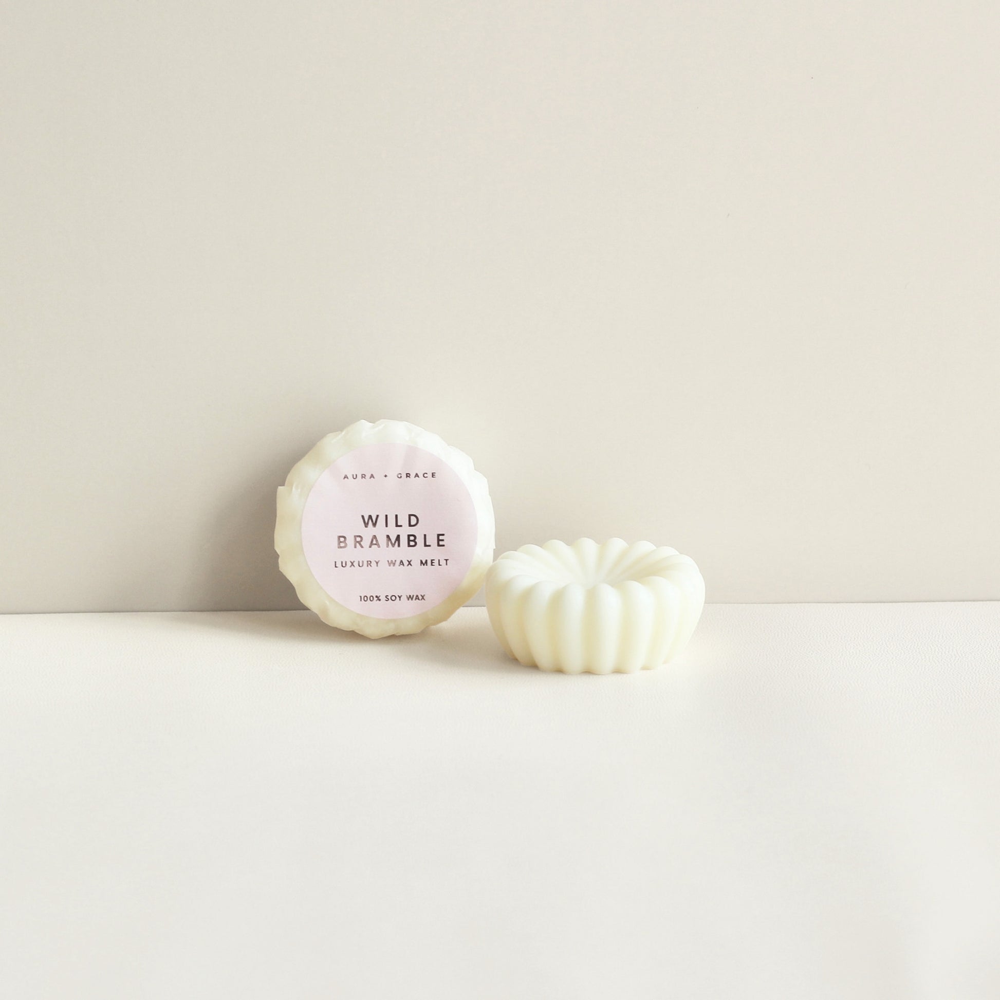 Wild Bramble soy wax melts showing wrapped and unwrapped melt by Aura + Grace